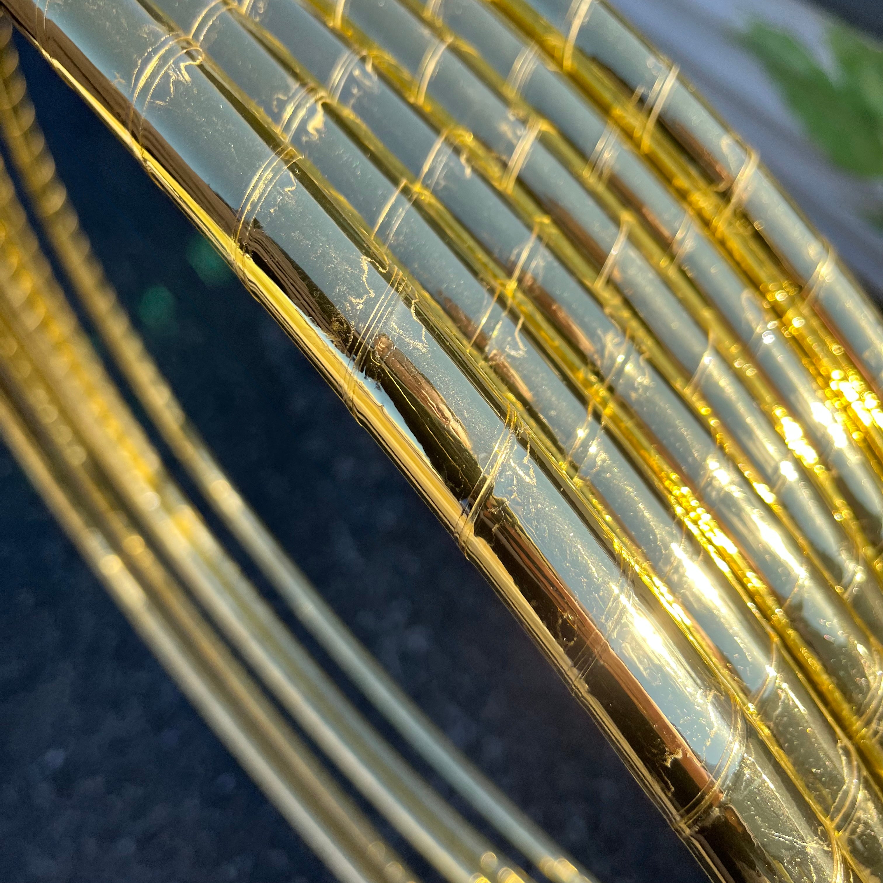 Close up of gold mirror tape on hula hoops. 