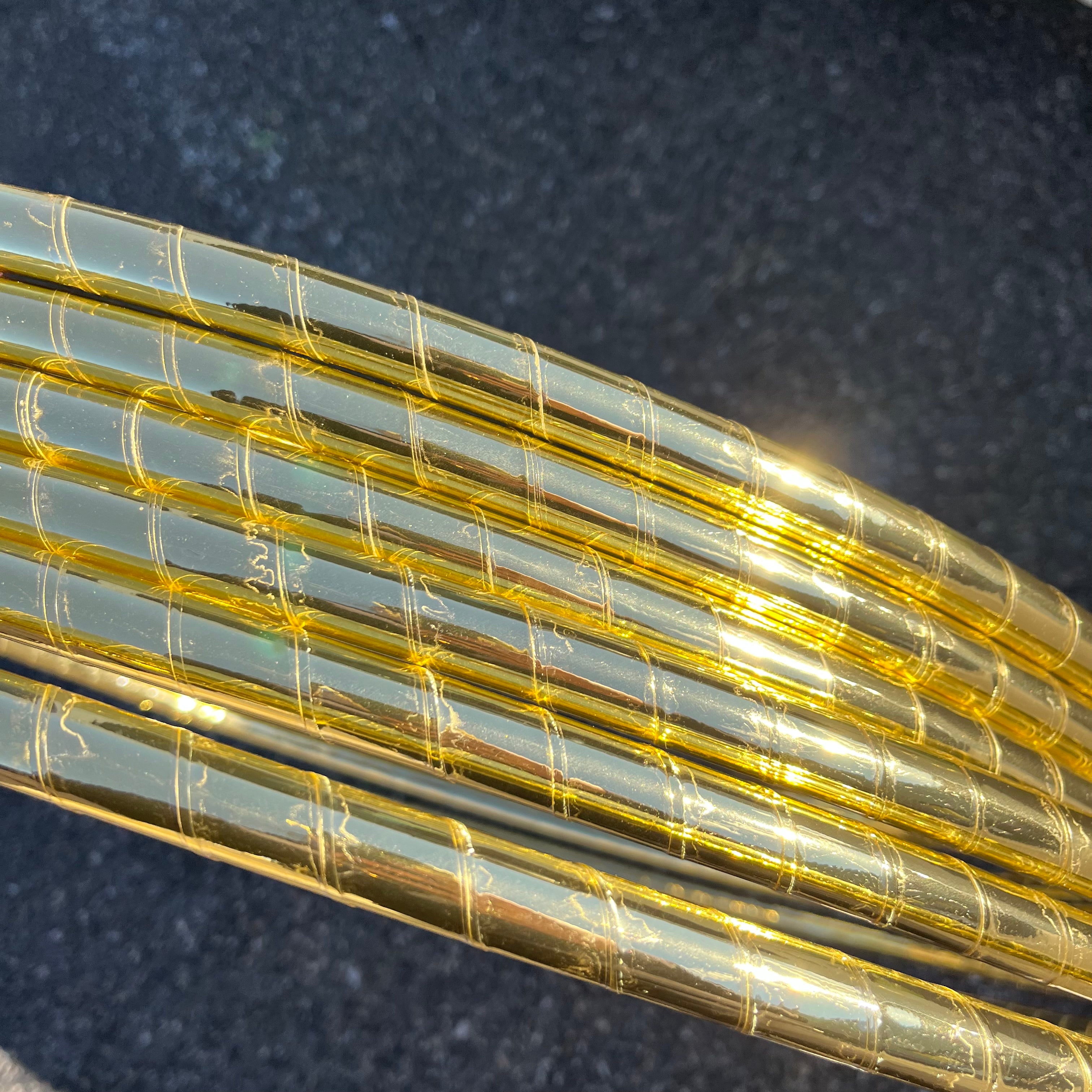 Gold mirror hula hoop tape sparkling in the sunlight. 
