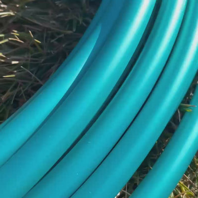 Teal Shadow Pearl polypro hoop tubing shimmering under sunlight.