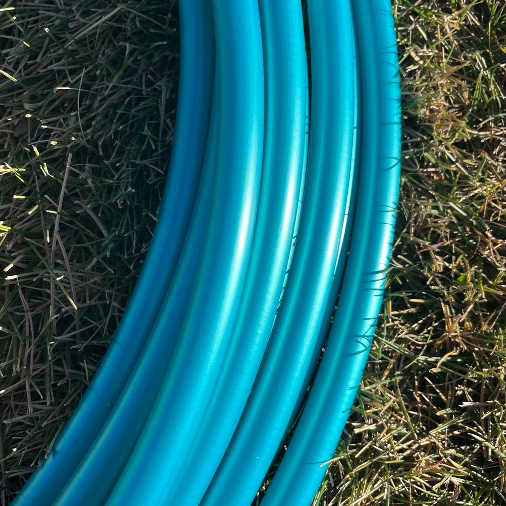 Teal Shadow Pearl polypro hula hoop tubing laying flat to show color and shine.