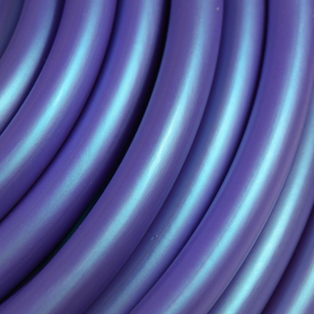 Close-up of Poseidon blue HDPE hula hoop tubing showing soft, flexible texture and rich color.